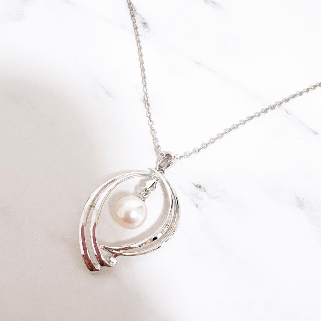 Mikimoto silver necklace featuring a 6mm Akoya pearl pendant measuring 3.1 cm by 1.8 cm on a 40.2 cm chain