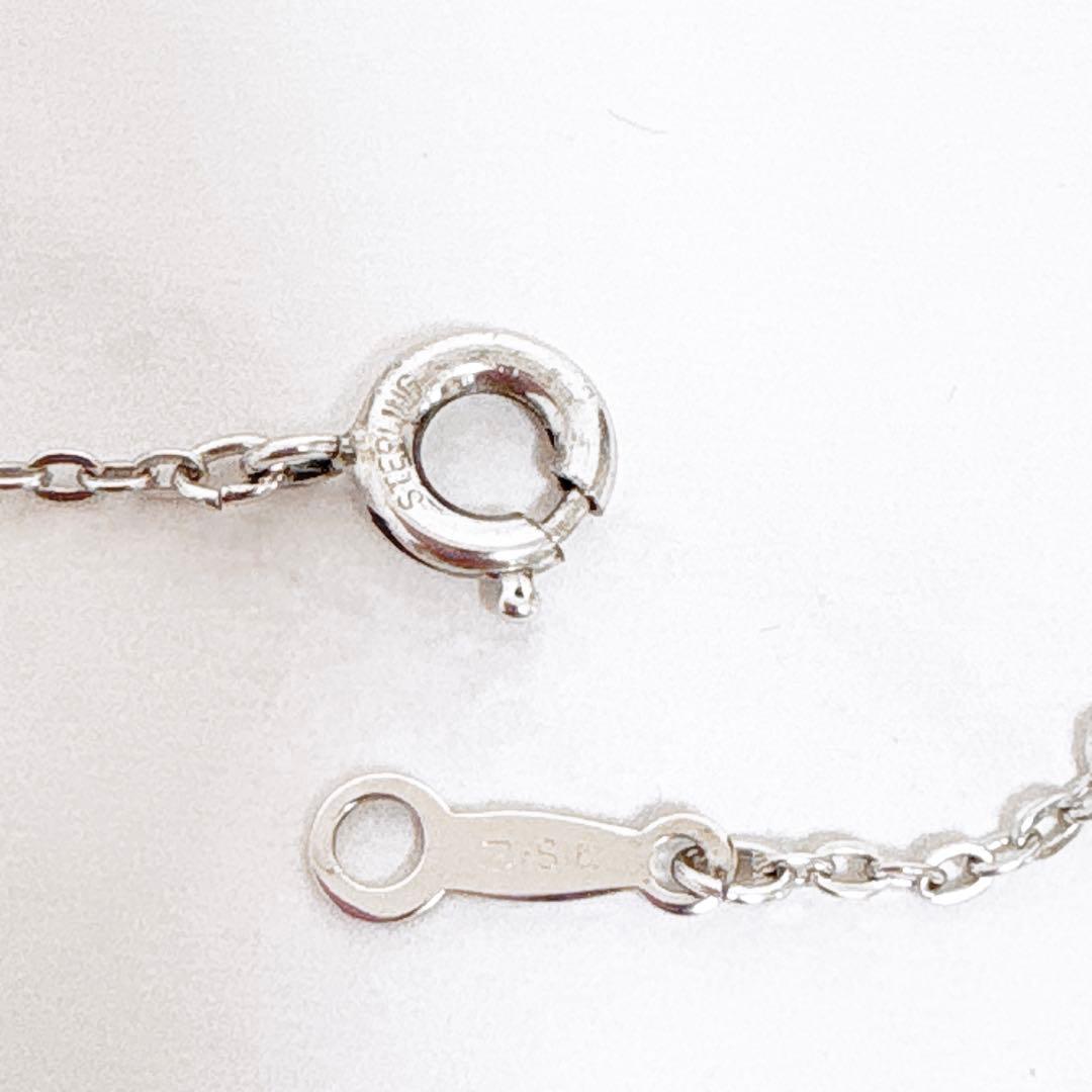 Mikimoto silver necklace featuring a 6mm Akoya pearl pendant measuring 3.1 cm by 1.8 cm on a 40.2 cm chain
