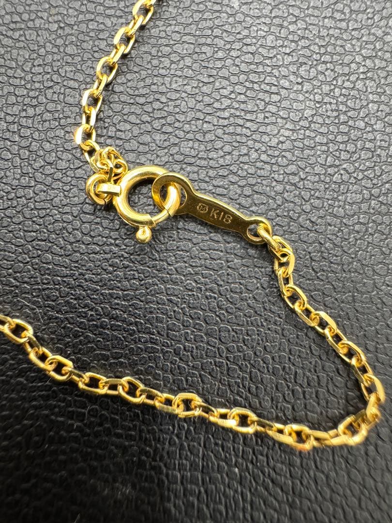MIKIMOTO pearl necklace made of yellow 18K gold, 50 cm length, displayed on a white background