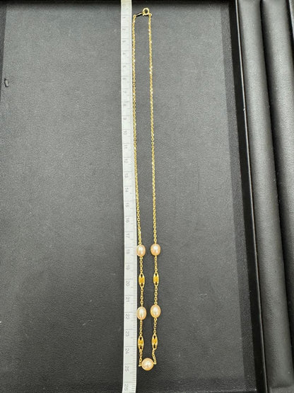 MIKIMOTO pearl necklace made of yellow 18K gold, 50 cm length, displayed on a white background