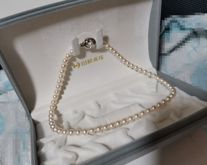 Tasaki Pearl Necklace 42 cm length with round 6.5 to 7 mm white pearls on a delicate string