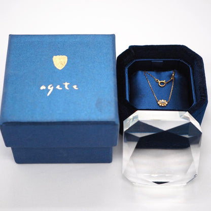 Close-up of ageteK18YG 0.05ct diamond necklace with 40cm adjustable azuki chain in yellow gold
