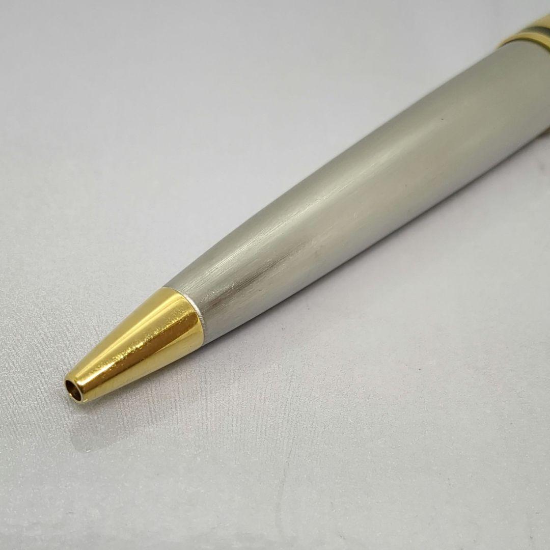 Waterman Expert ballpoint pen with steel satin finish and 23K gold trim, showing minor wear