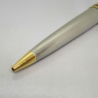 Waterman Expert ballpoint pen with steel satin finish and 23K gold trim, showing minor wear