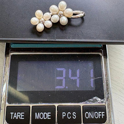 Mikimoto silver flower pearl pendant top with Perleita service chain, 34.1mm height, 15mm width, weighing 3.41g