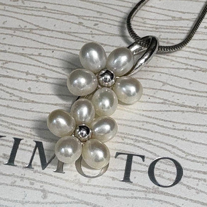 Mikimoto silver flower pearl pendant top with Perleita service chain, 34.1mm height, 15mm width, weighing 3.41g