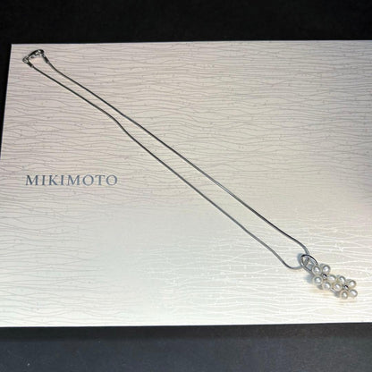 Mikimoto silver flower pearl pendant top with Perleita service chain, 34.1mm height, 15mm width, weighing 3.41g