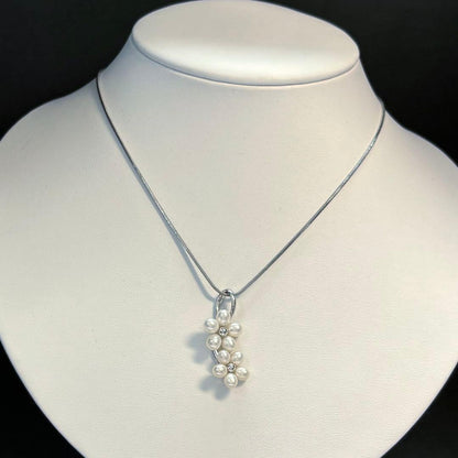 Mikimoto silver flower pearl pendant top with Perleita service chain, 34.1mm height, 15mm width, weighing 3.41g