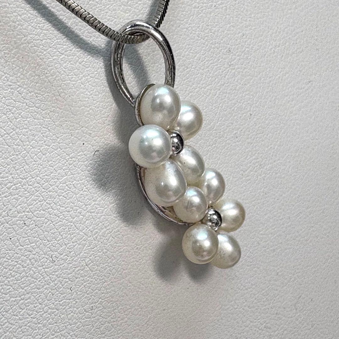 Mikimoto silver flower pearl pendant top with Perleita service chain, 34.1mm height, 15mm width, weighing 3.41g