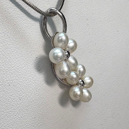 Mikimoto silver flower pearl pendant top with Perleita service chain, 34.1mm height, 15mm width, weighing 3.41g