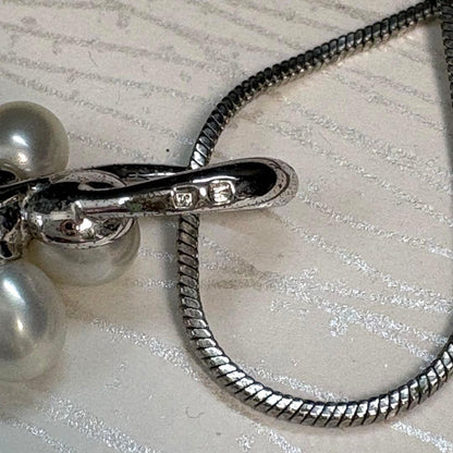 Mikimoto silver flower pearl pendant top with Perleita service chain, 34.1mm height, 15mm width, weighing 3.41g