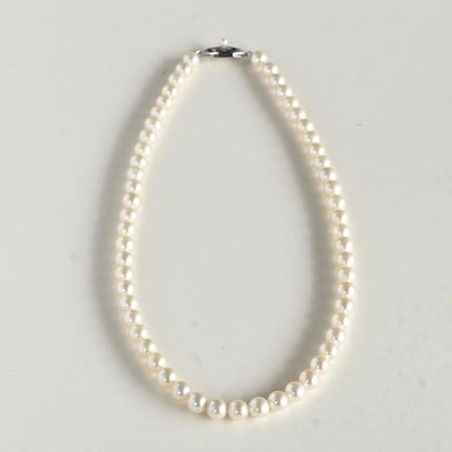 Takatsuki Akoya pearl necklace featuring round 6.5-6 mm pearls on a 37 cm strand