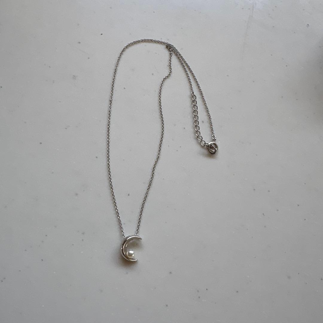 Tasaki Baby Pearl and Moon Necklace featuring silver moon pendant and lustrous pearls