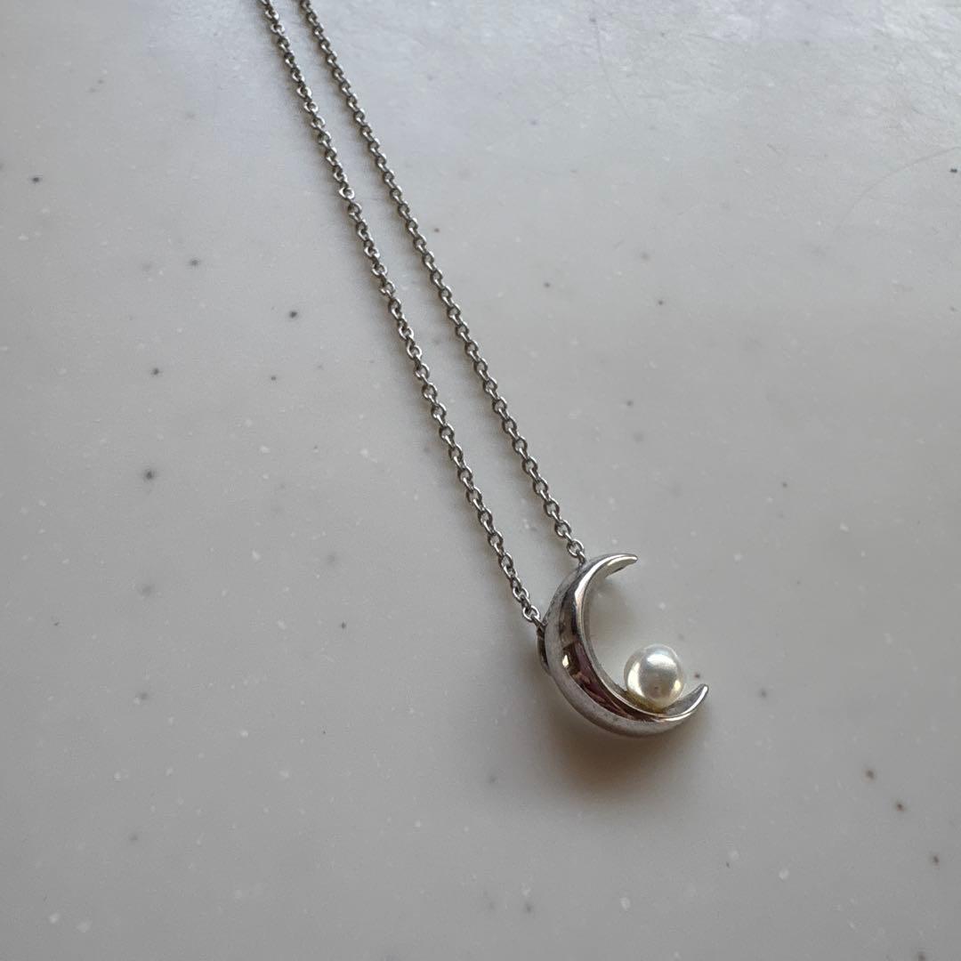 Tasaki Baby Pearl and Moon Necklace featuring silver moon pendant and lustrous pearls