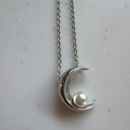 Tasaki Baby Pearl and Moon Necklace featuring silver moon pendant and lustrous pearls