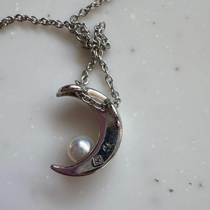 Tasaki Baby Pearl and Moon Necklace featuring silver moon pendant and lustrous pearls