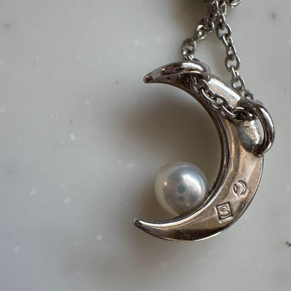Tasaki Baby Pearl and Moon Necklace featuring silver moon pendant and lustrous pearls