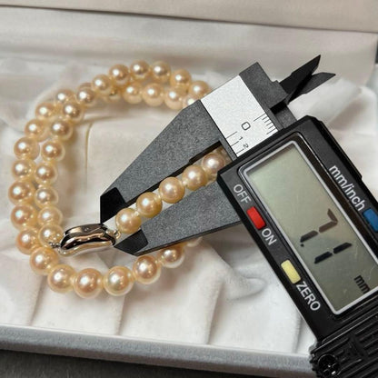 Akoya pearl white necklace with pearls sized 7.1 to 8.0mm and silver clasp, approximately 38cm long