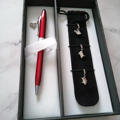 Red Cross Disney Limited Sentiment rotating ballpoint pen with 4 charms and black carrying case