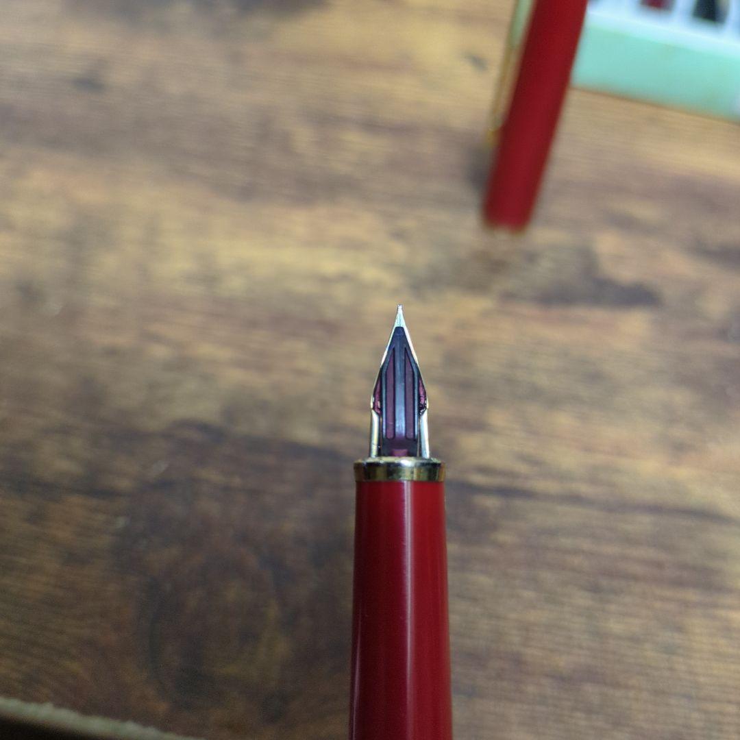Pilot Fountain Pen Red with 14K gold nib and red cap showing slight wear on cap ring and nib base