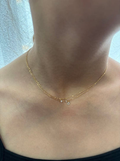 Agete diamond necklace 18K gold with a 70 cm long chain displayed on a white background