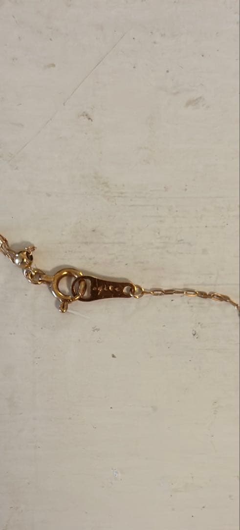 Agete diamond necklace 18K gold with a 70 cm long chain displayed on a white background
