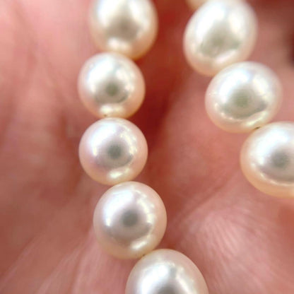Akoya white pearl necklace with 7 to 7.5 mm pearls on a 43 cm strand featuring a certification tag