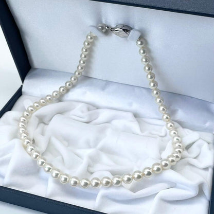 Akoya white pearl necklace with 7 to 7.5 mm pearls on a 43 cm strand featuring a certification tag