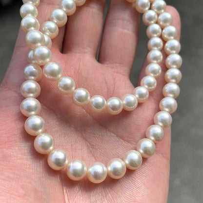 Akoya white pearl necklace with 7 to 7.5 mm pearls on a 43 cm strand featuring a certification tag