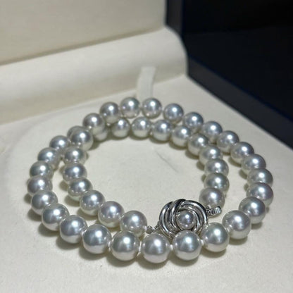 Tasaki Akoya pearl necklace with 8.5-9.0mm pearls and silver clasp on a white background