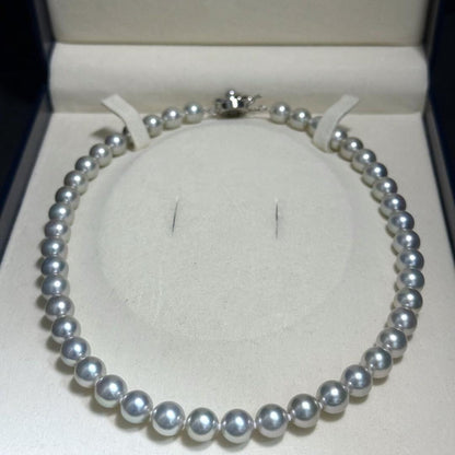 Tasaki Akoya pearl necklace with 8.5-9.0mm pearls and silver clasp on a white background