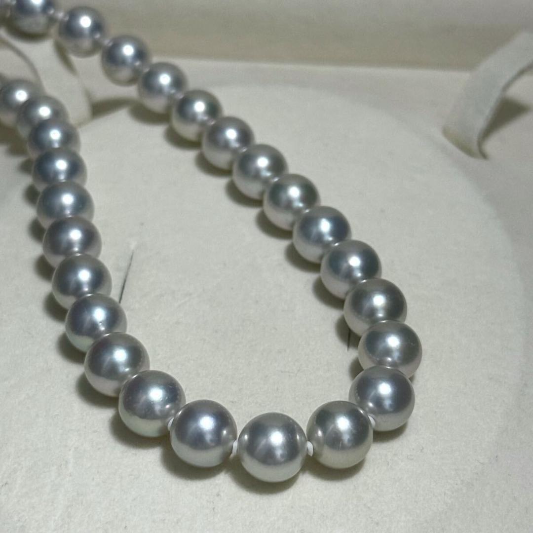 Tasaki Akoya pearl necklace with 8.5-9.0mm pearls and silver clasp on a white background