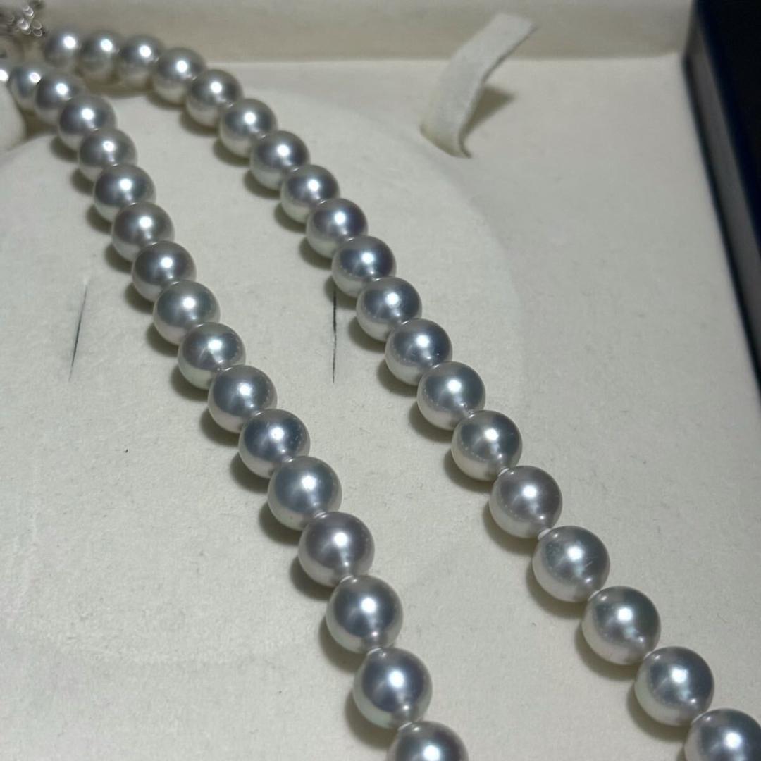 Tasaki Akoya pearl necklace with 8.5-9.0mm pearls and silver clasp on a white background