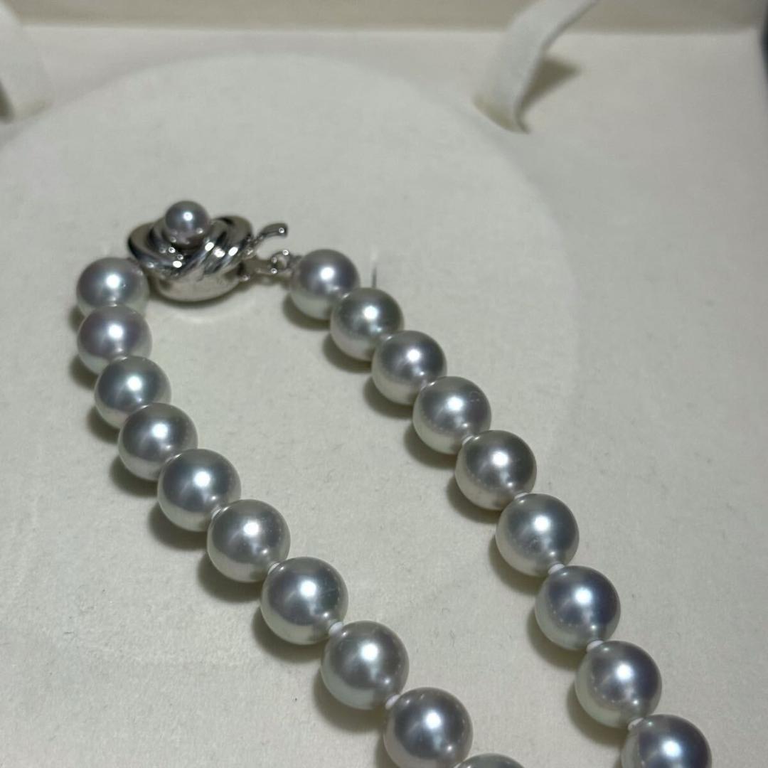 Tasaki Akoya pearl necklace with 8.5-9.0mm pearls and silver clasp on a white background