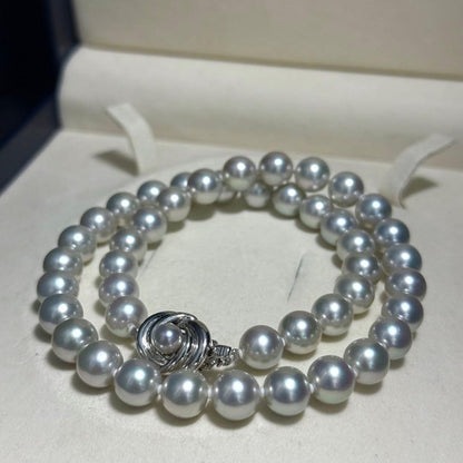 Tasaki Akoya pearl necklace with 8.5-9.0mm pearls and silver clasp on a white background