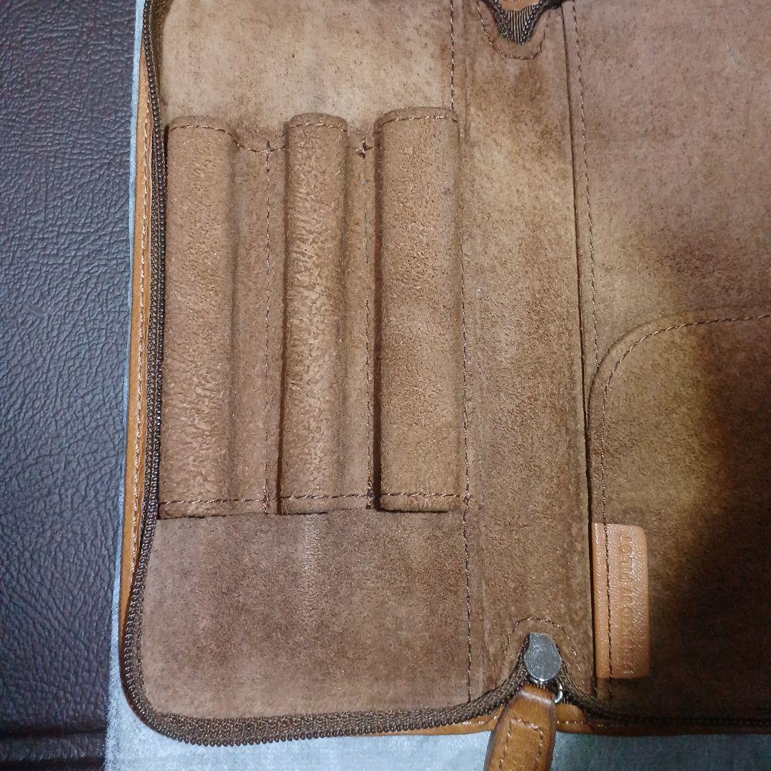 Brown leather Pentsamble Round Zip pen case with zip closure and long wallet design