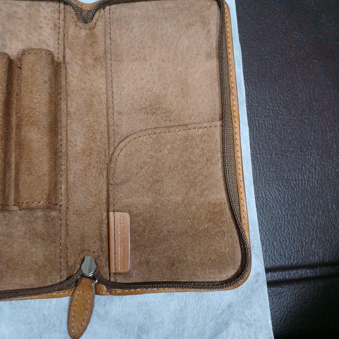 Brown leather Pentsamble Round Zip pen case with zip closure and long wallet design