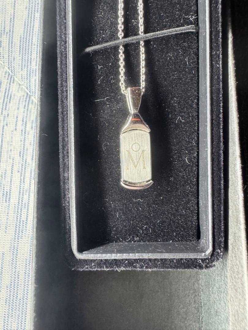MIKIMOTO Silver 925 necklace with plate-type pendant and included chain on white background