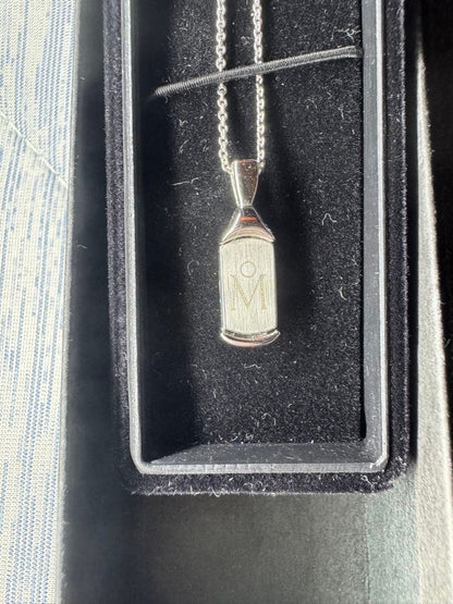MIKIMOTO Silver 925 necklace with plate-type pendant and included chain on white background