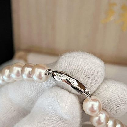 Akoya pearl necklace with white pearls sized 8.0 to 8.5mm on a 41cm strand with silver clasp