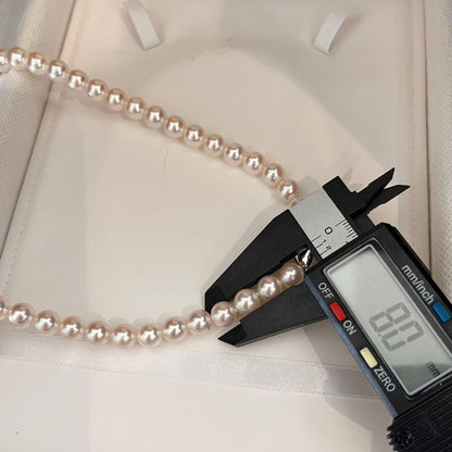Akoya pearl necklace with white pearls sized 8.0 to 8.5mm on a 41cm strand with silver clasp