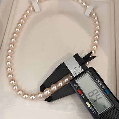 Akoya pearl necklace with white pearls sized 8.0 to 8.5mm on a 41cm strand with silver clasp