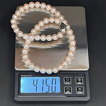 Akoya pearl necklace with white pearls sized 8.0 to 8.5mm on a 41cm strand with silver clasp