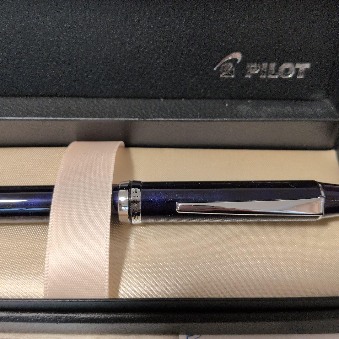 Pilot RiDGE multi-function pen with black and blue ink, sleek black body, shown on white background