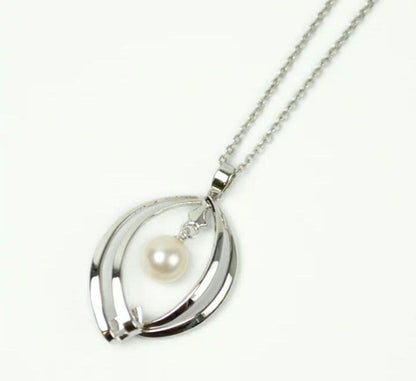 Set of four including Mikimoto silver pearl necklace, Nina Ricci necklace, Nina Ricci handkerchief, and cosmetic item