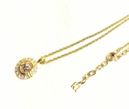 Set of four including Mikimoto silver pearl necklace, Nina Ricci necklace, Nina Ricci handkerchief, and cosmetic item