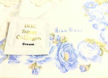 Set of four including Mikimoto silver pearl necklace, Nina Ricci necklace, Nina Ricci handkerchief, and cosmetic item