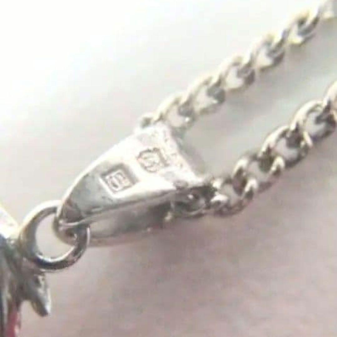 Set of four including Mikimoto silver pearl necklace, Nina Ricci necklace, Nina Ricci handkerchief, and cosmetic item