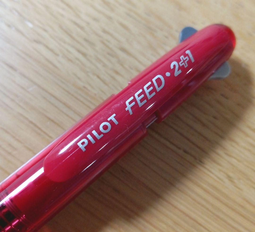 Pilot Feed 2+1 multi-function pen with red barrel and black and red 0.5mm ballpoint tips