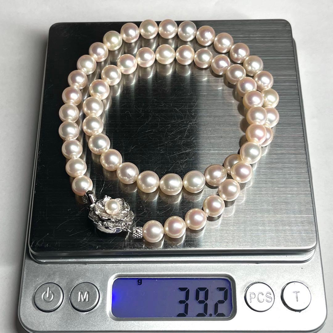 Akoya pearl necklace with 7.5-8.0mm white pearls and silver clasp displayed on white background